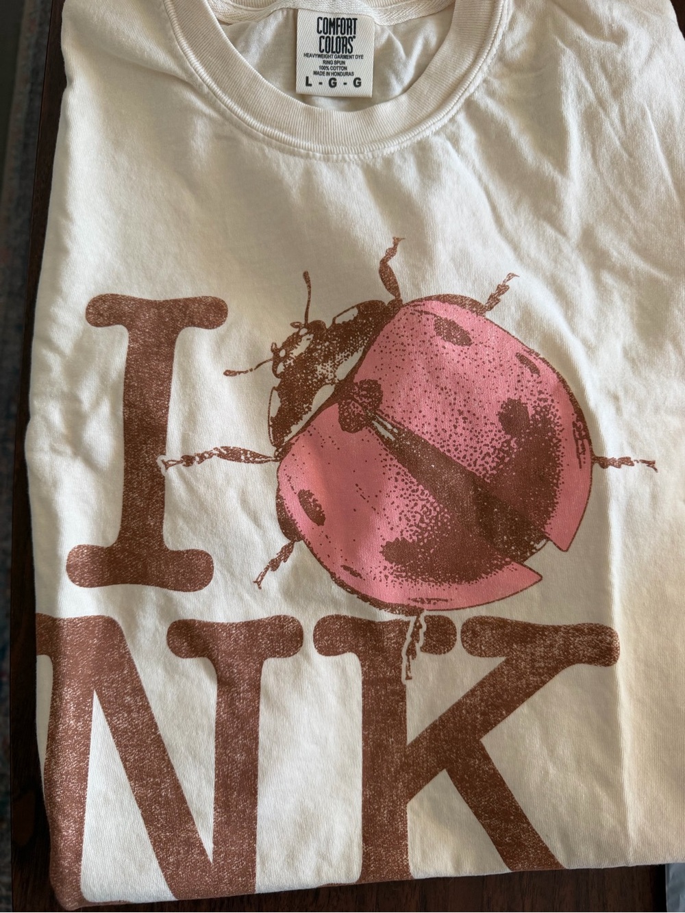 AUTHENTIC - Noah Kahan Comfort Colors White Tee with Pink & Brown Ladybug Print
